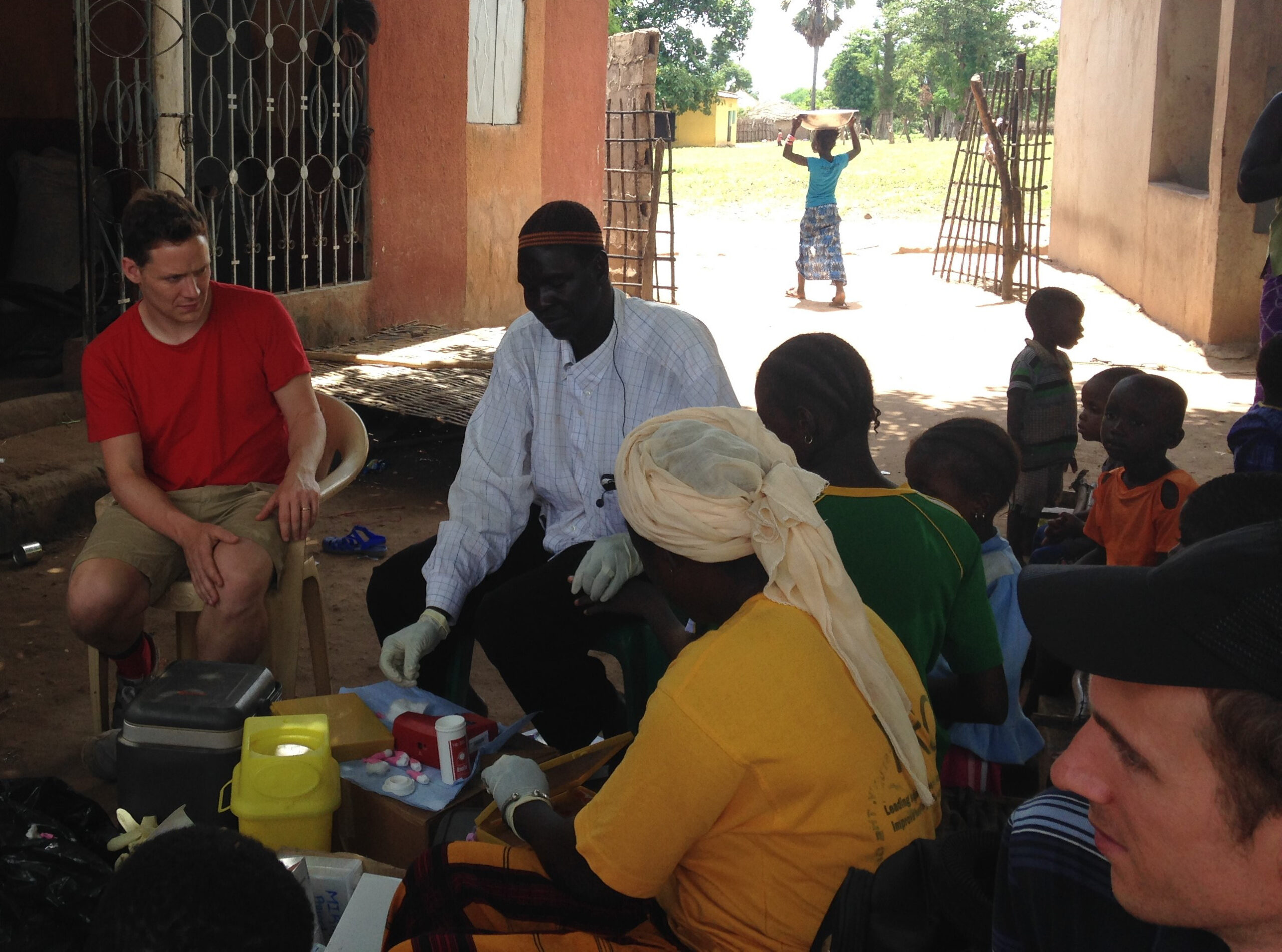 Testing malaria infections: blood sample collections in a village near Basse, The Gambia. Photo credit: Ellen Leffler.
